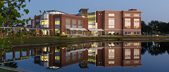 Sanford/Lake Mary Student Center building with reflection showing in the lake